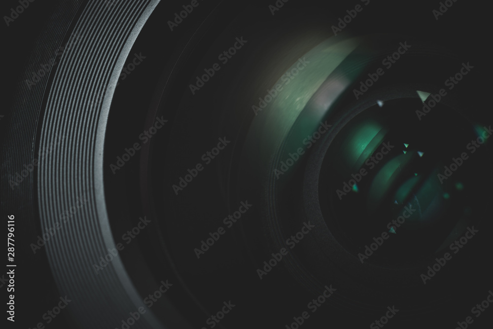 Poster close up beautiful camera lens with color reflection background.