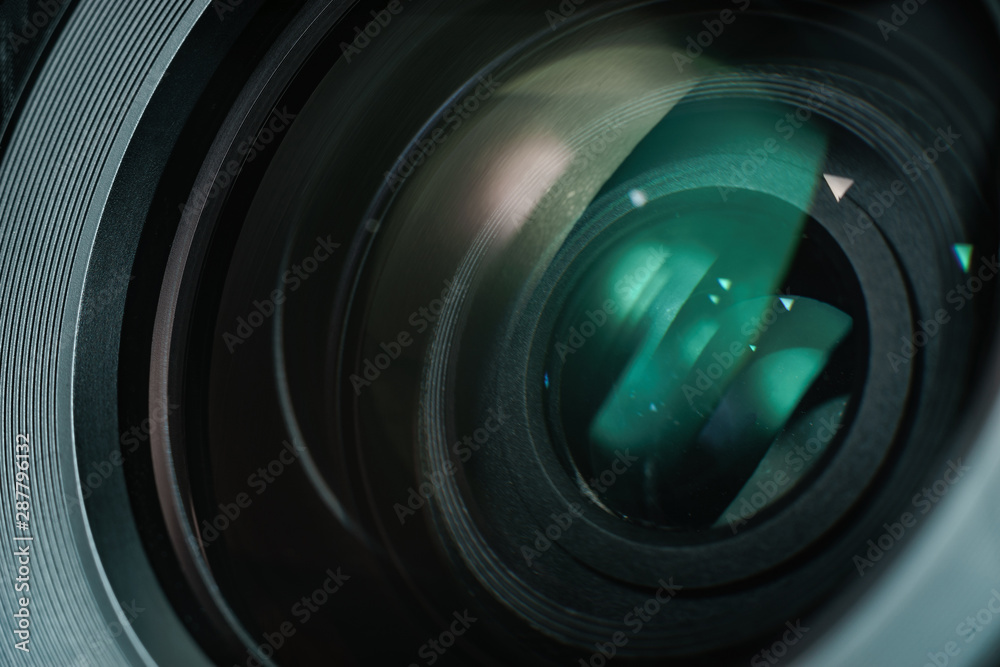 Poster close up beautiful camera lens with color reflection background.