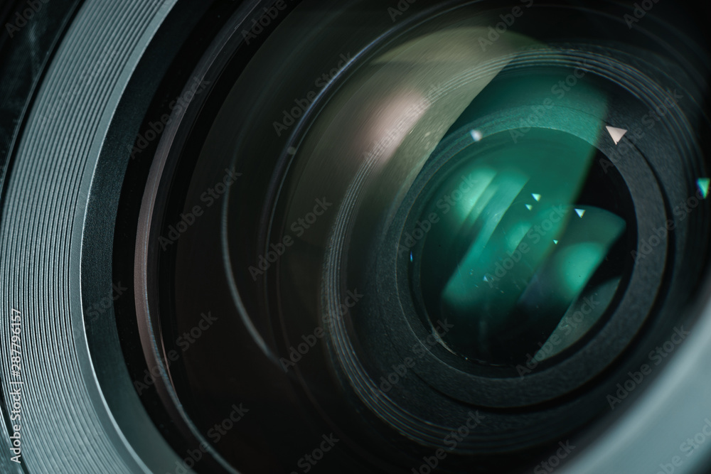 Poster close up beautiful camera lens with color reflection background.