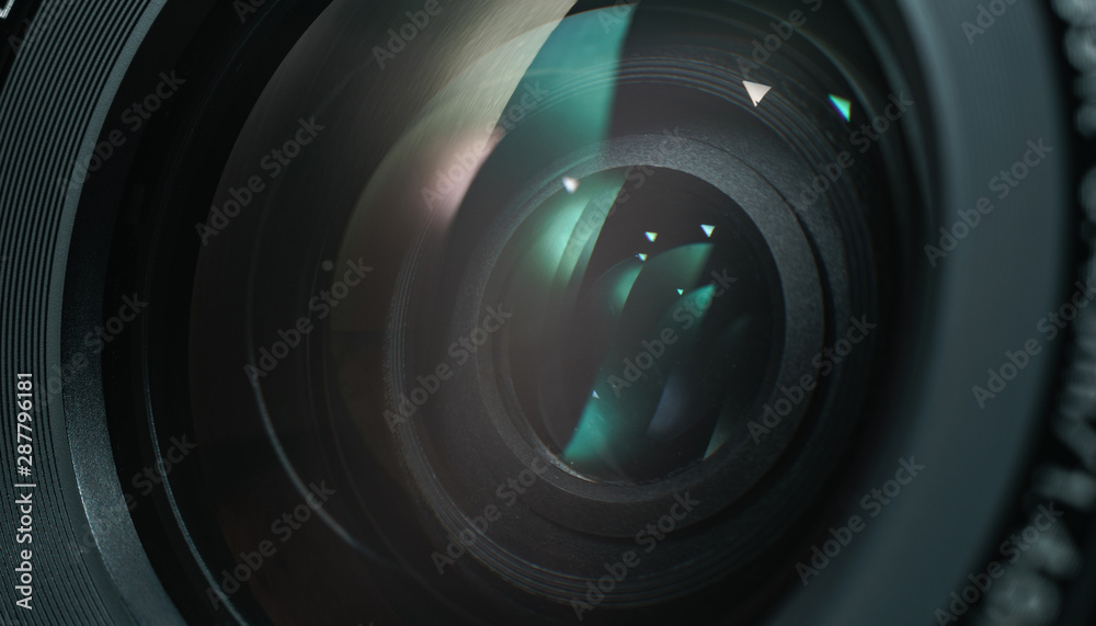 Poster close up beautiful camera lens with color reflection background.