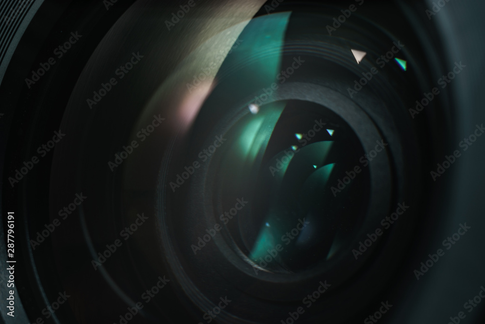 Poster close up beautiful camera lens with color reflection background.