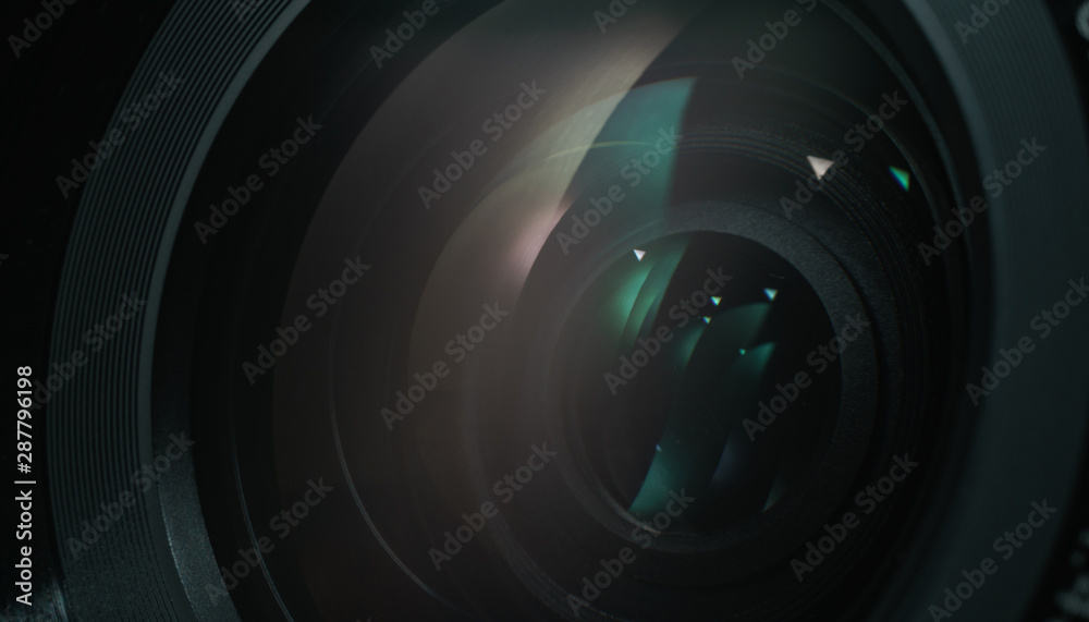 Poster close up beautiful camera lens with color reflection background.