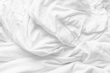 Soft white fabic texture wrinkled texture ,Soft focus white fabic crumpled from bedding blanket use...