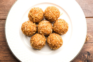 Jaggery coconut Laddoo / Nariyal gur ke laddu, indian sweet food for festivals like rakshabandhan/rakhi pournima