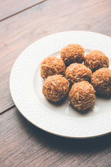 Jaggery coconut Laddoo / Nariyal gur ke laddu, indian sweet food for festivals like rakshabandhan/rakhi pournima