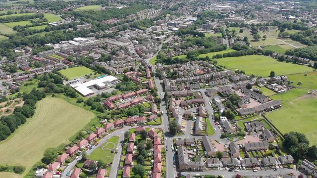 Aerial footage of the town of Batley in the Metropolitan Borough of Kirklees, West Yorkshire, England, taken on a bright sunny day