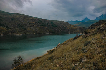 the lake is located deep in the mountains in cloudy weather.