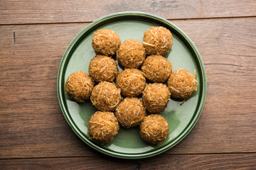 Jaggery coconut Laddoo / Nariyal gur ke laddu, indian sweet food for festivals like rakshabandhan/rakhi pournima