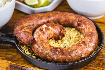 Typical food table in the interior of Brazil. Pork, beans, bean tutu, pork rinds, rice and farofa. Mining food, made at home. Flavors of Brazil.