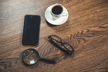 Obraz na płótnie Canvas phone with glasses and coffee