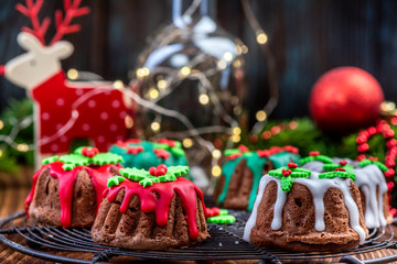 Christmas Pudding Cake in Festive Decoration on Christmas Table
