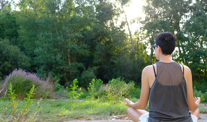 Girl meditating alone in nature