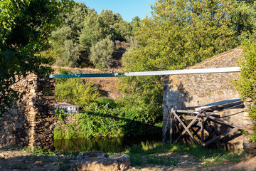 Watermill wheel with nature surrounding © raquel