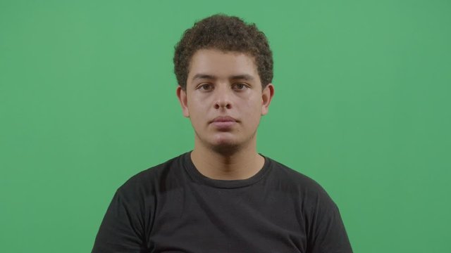 Young Boy Pimple Popping Looking At The Camera
