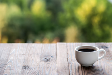 White coffee cup on vintage wooden table