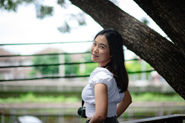 Beautiful Asian woman with vintage film camera