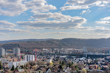 Fototapeta premium Cityscape of Brugg West with industry and the dam. Aerial panoramic view.