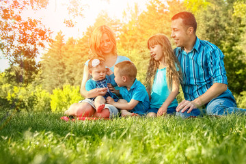 Fototapeta premium happy family outdoors in the park