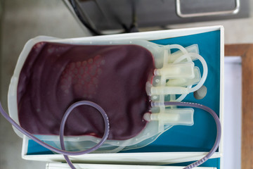 The blood bag is on the blood mixer.