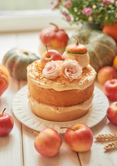 Naked Cake with Apples. Thanksgiving Day table. Happy Halloween Pumpkins, apples and flowers. Bright autumn background. Colorful autumn card. Autumn flower arrangement. Autumn bouquet