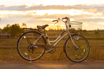 Fototapeta na wymiar Bicycle on the sunset background