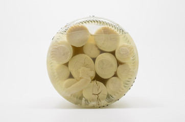 Canned Hearts of Palm. Palmito on a transparent glass.