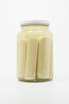 Canned Hearts of Palm. Palmito on a transparent glass.