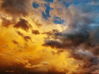An epic sky before a thunderstorm in yellow-blue