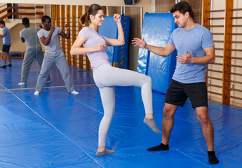 People practicing self defense techniques