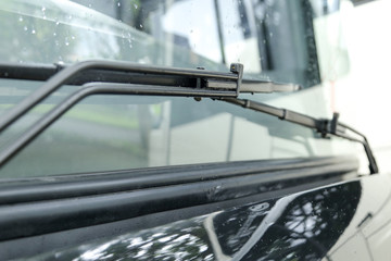 bus windscreen wiper blades on rain weather close up