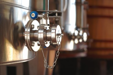 Food grade stainless steel butterfly valve on a wine tank with a standard DIN sanitary end cap