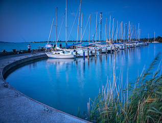 Fototapeta na wymiar Sailboats in the port on lake Balaton in summer