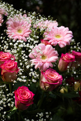 Roses, gerberas and gypsophila combined in a flower arrangement. 2