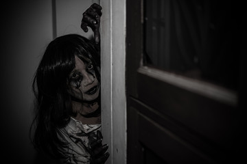 Portrait of asian woman make up ghost face,Horror scene,Scary background,Halloween poster