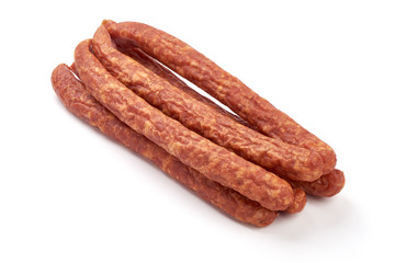 Long thin dry sausages, isolated on white background