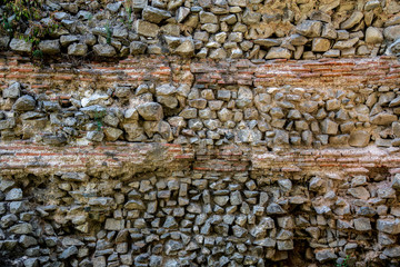 Granite stone wall with bricks