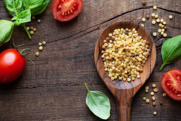Fregola or fregula sarda - Traditional type of ball shaped toasted pasta typical of Sardinia region. Overhead view