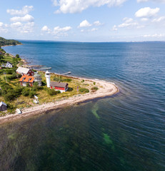 Aerial view of Haken lighthouse on the island Ven in southern Sweden a warm summer day in tourist season. 