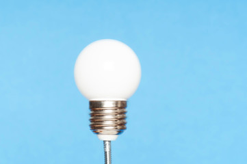 light bulb on light blue background