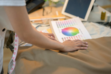 hand of designer working in her place, compare color