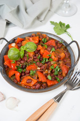 Healthy vegetarian meal of steamed vegetables. Red beans, paprika, tomatoes and greens stewed in tomato sauce. Traditional Caucasian dish - lobio.