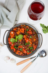 Healthy vegetarian meal of steamed vegetables. Red beans, paprika, tomatoes and greens stewed in tomato sauce. Traditional Caucasian dish - lobio.