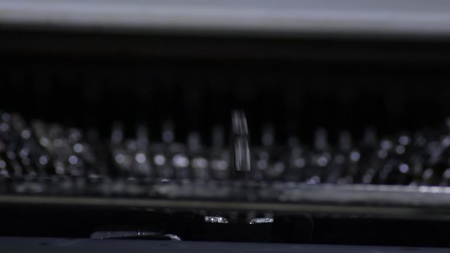Keys hitting while typing in an old qwerty typewriter