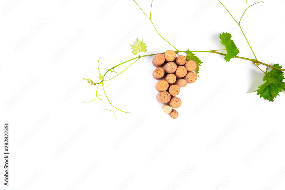 Wall mural Wine corks grape shape and vine. Isolated on white background. Top view with copy space for your text - Image