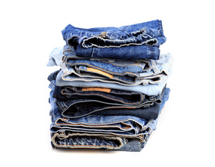 Stack of jeans pants on white background - Image