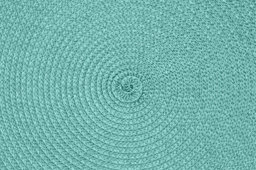Bright teal textured concentric circle fabric material background