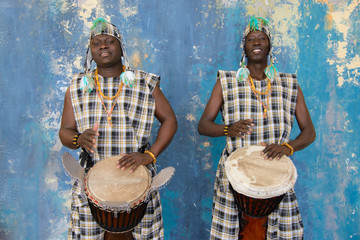 Two African musician with traditional clothes and drums