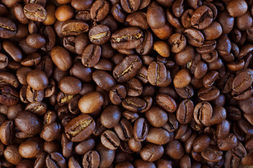 Roasted coffee beans background. Organic coffee. Close Up.