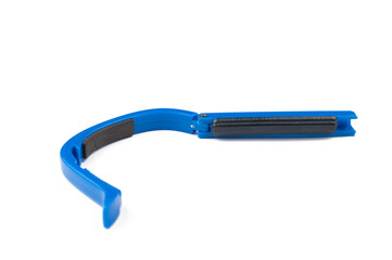 Blue guitar capo isolated on white background.Copy space