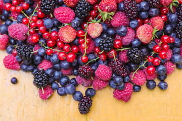black berry red currant strawberries mulberry and raspberry berries for health background